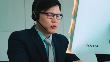 business people wearing headset working in office