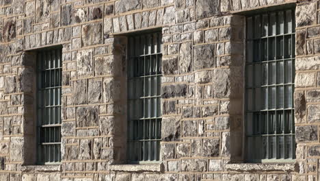 barred windows in masonry wall building