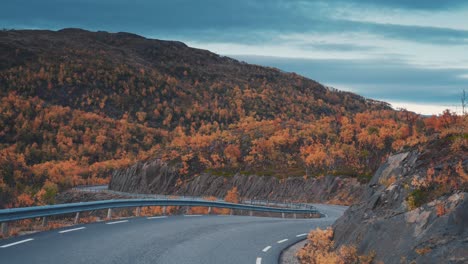 driving down the curvy mountain road through the autumn valley