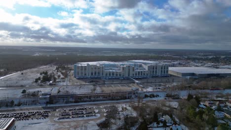 train traveling through a snowy cityscape in segefeld falkensee. gorgeous aerial view flight panorama overview drone
