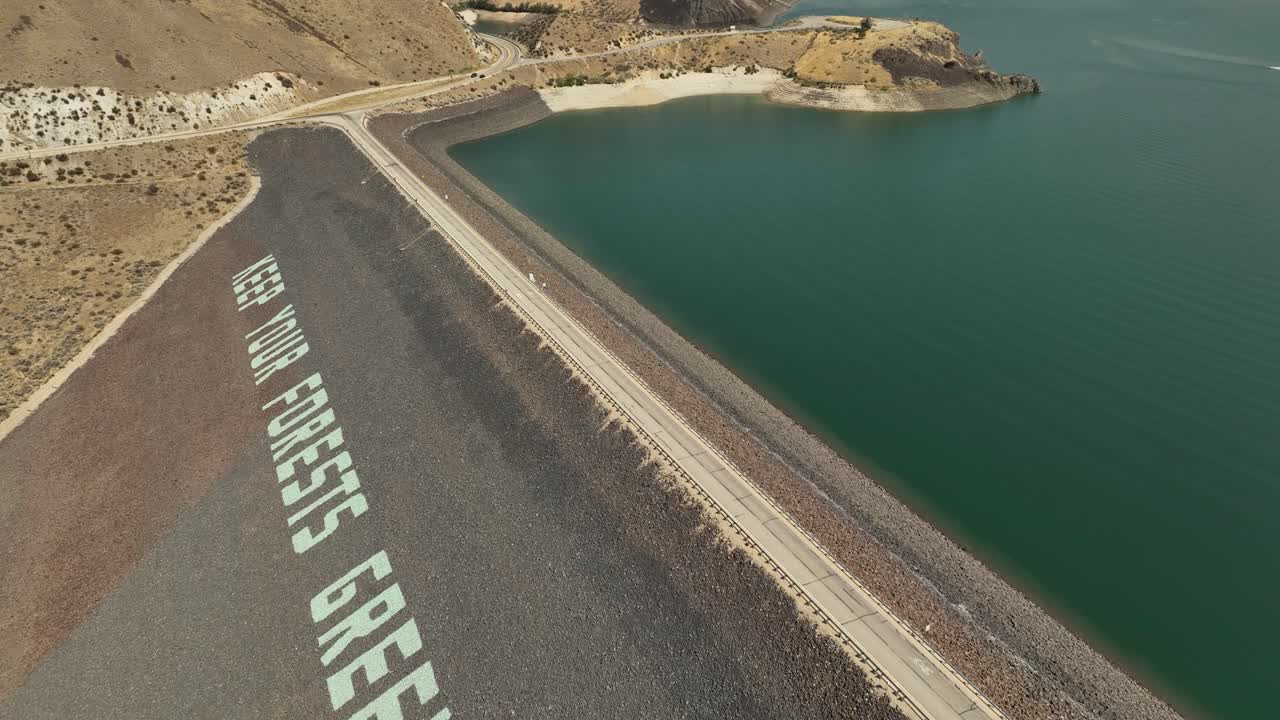 Aerial over Lucky Peak Dam Road along the Boise Reservoir embankment dam