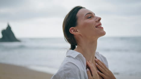 woman tourist walking seashore cloudy day close up. carefree girl enjoy vacation