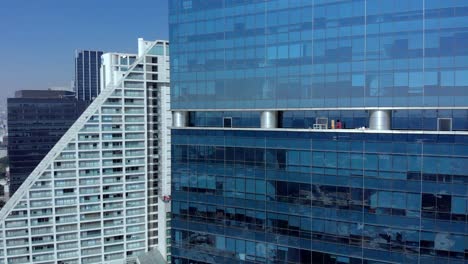 aerial view tall buildings in mexico city white blue clear sky