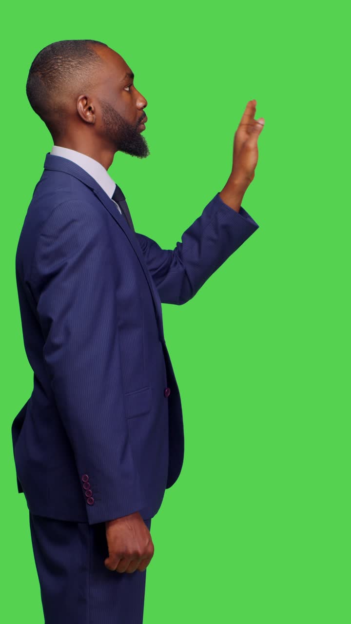 Vertical video: Profile of company manager examining 3d holographic image