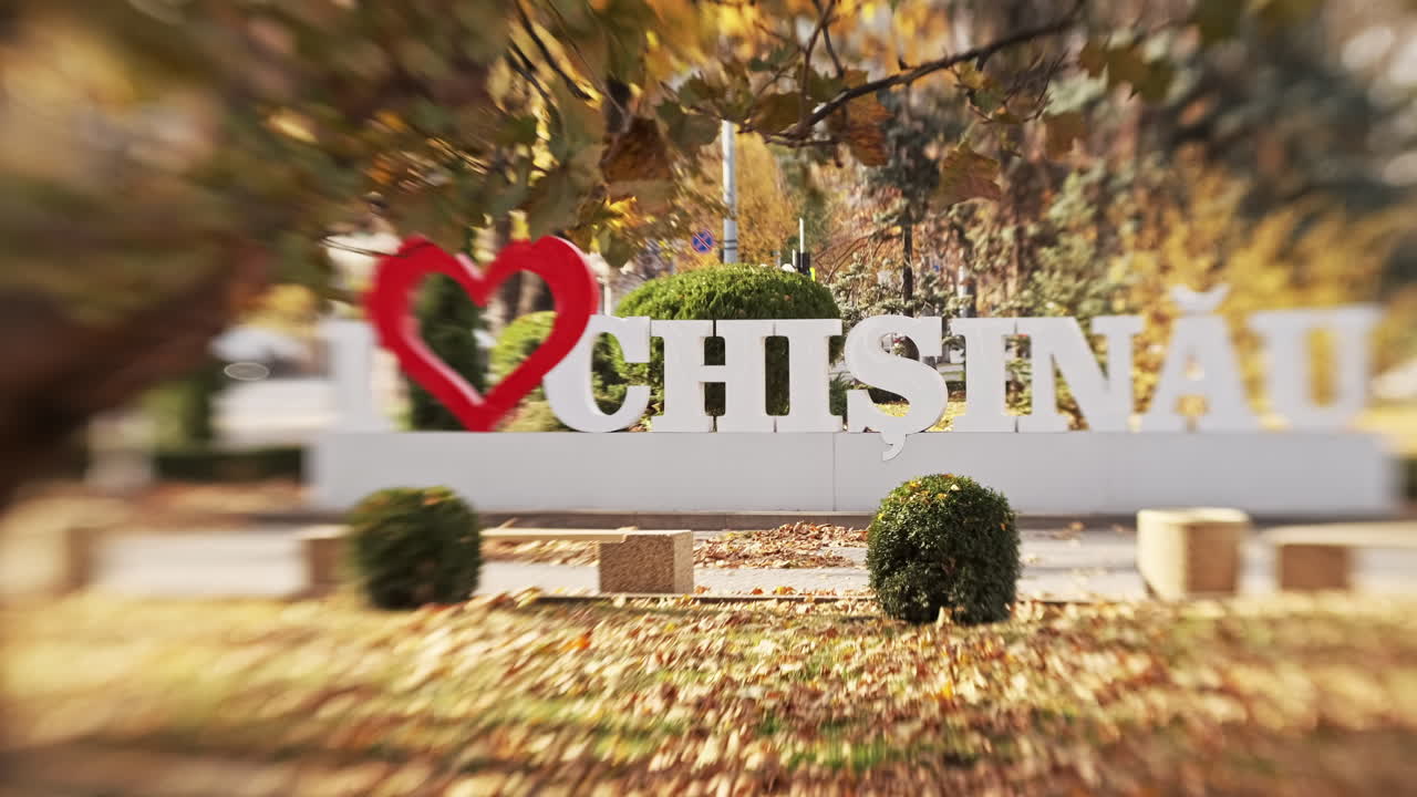 I love Chisinau installation at autumn, yellow leaves on the ground in Moldova. Lensbaby effect