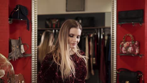 model demonstrates the dress she chose, the lady wore bright and shiny clothes