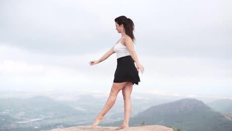 woman dancing on a mountaintop