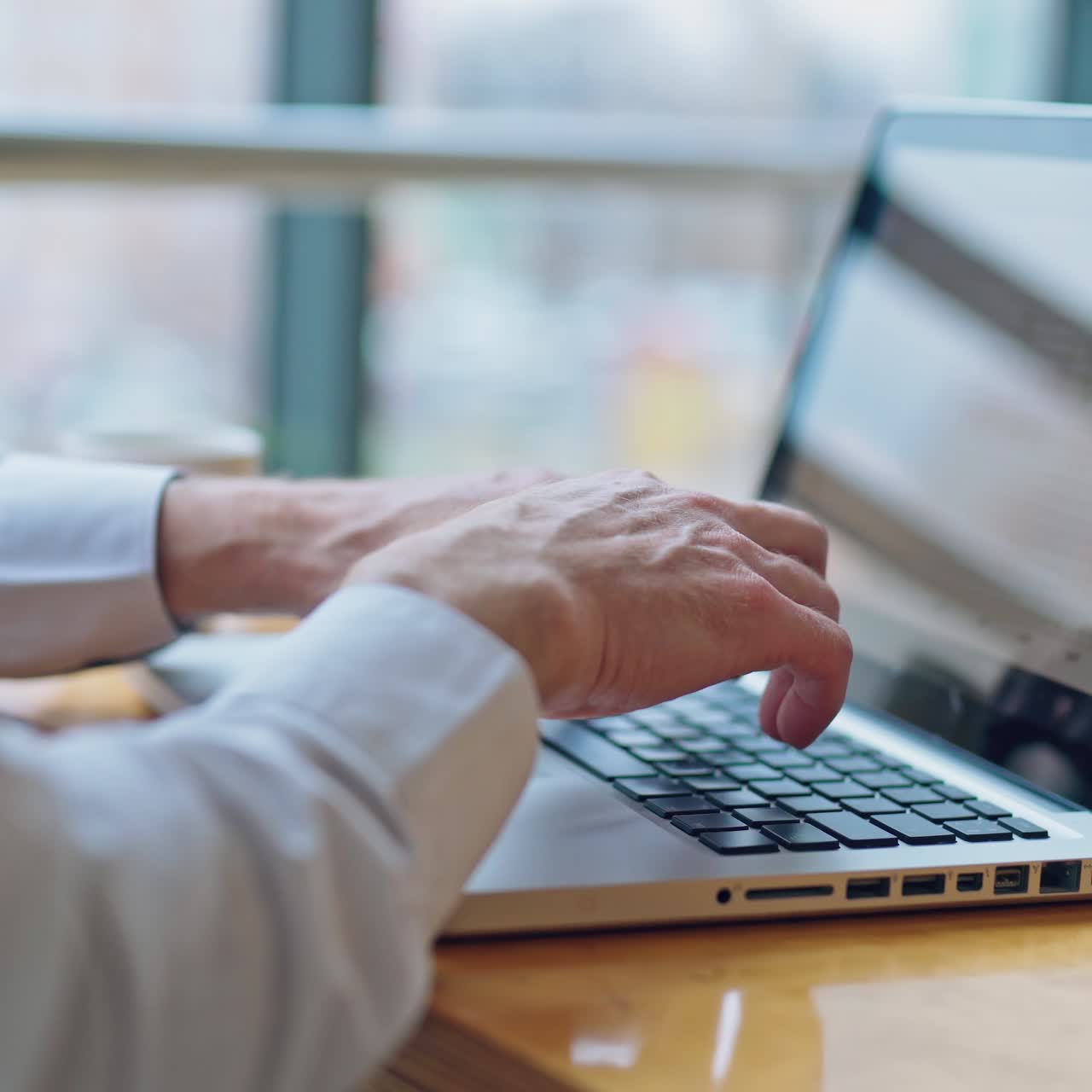 Image of man's hands typing on laptop. Selective focus. Business concept video.