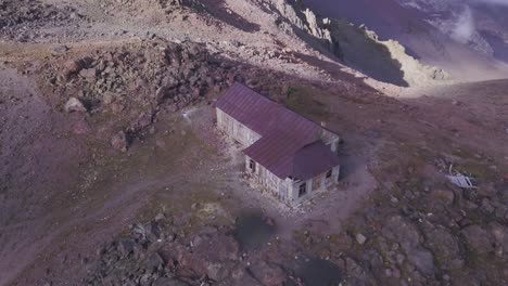 abandoned mountain hut on a rocky ridge