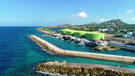 port harbor channel entrance and small fishing village in zakito curacao, aerial pedestal