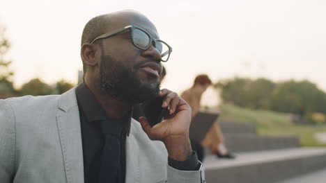 African-American-Businessman-Speaking-on-Phone-Outdoors