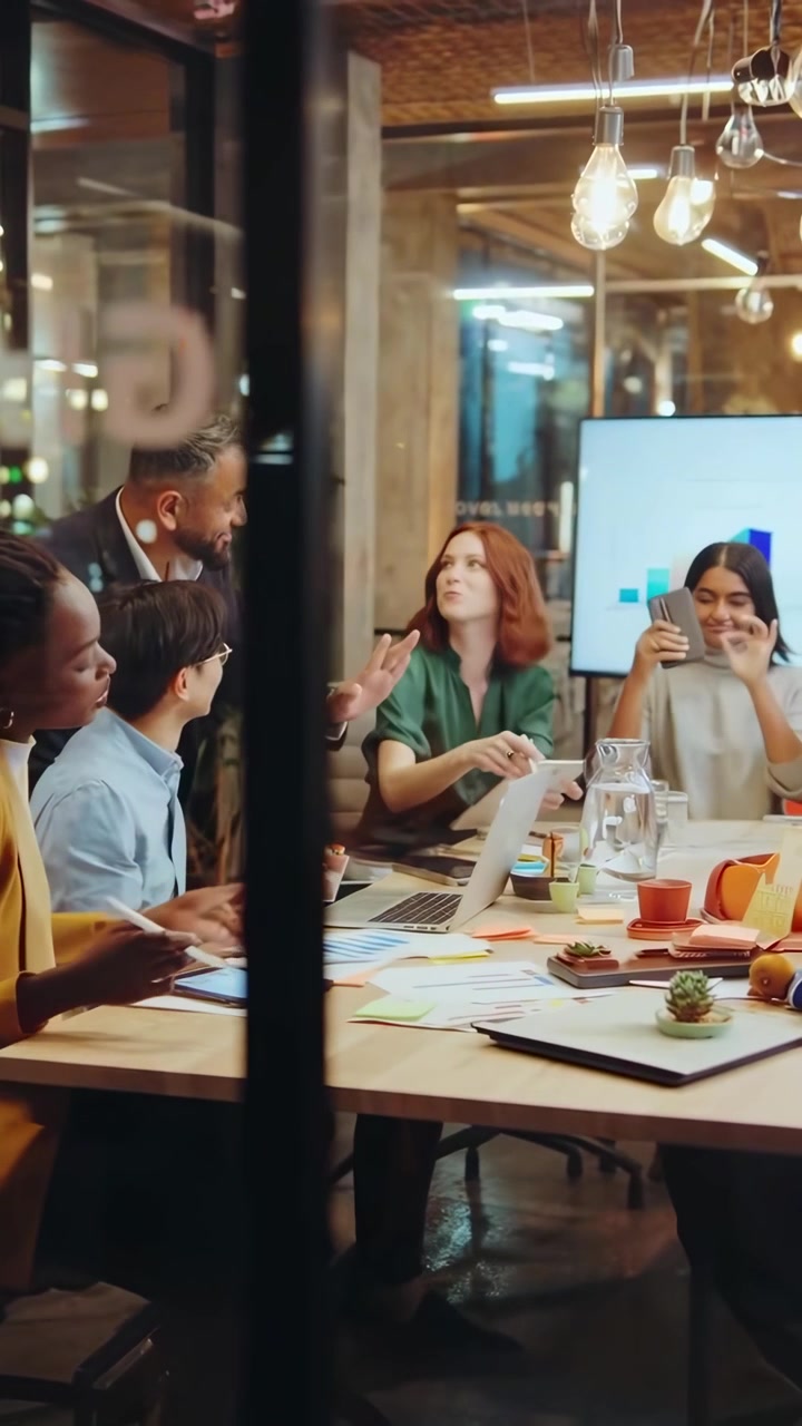 Diverse Business Team Collaborating in Modern Office Meeting