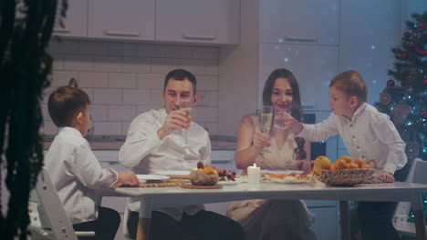 large caucasian family celebrating thanksgiving day chatting at dinner party table while eating roasted turkey and salads - celebration concept. high quality 4k footage