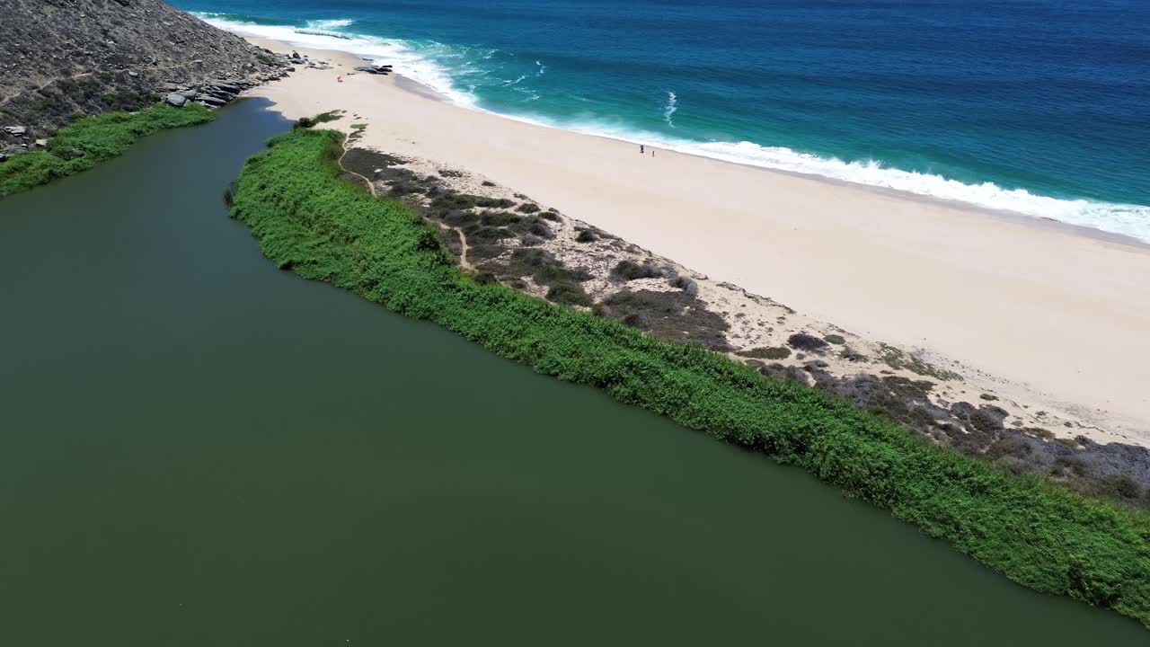 Aerial Shot of a Lagoon besides the ocean in Baja, near Cabo.