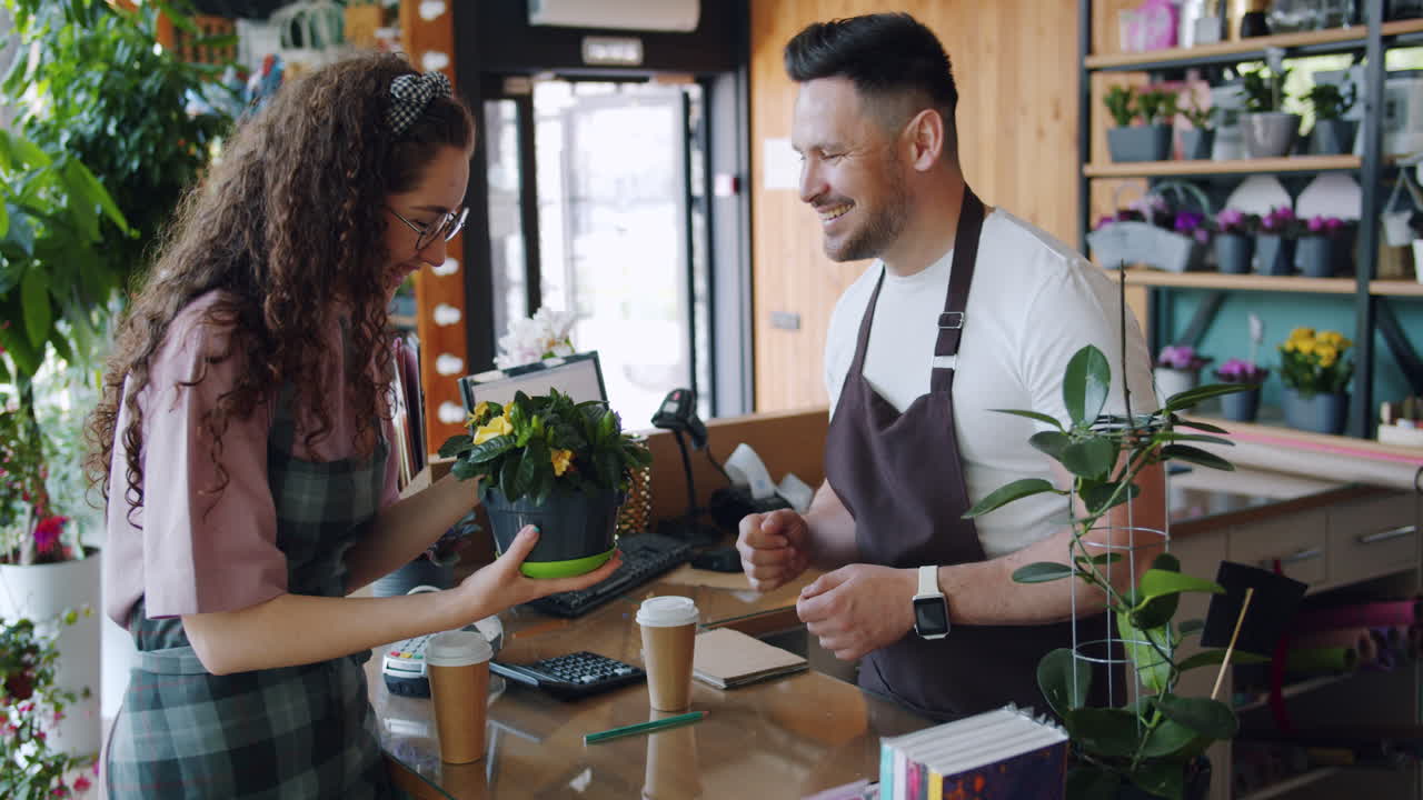 Customer Purchasing Plants in a Florist Shop