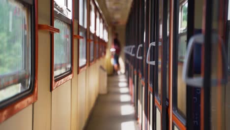 cabins and corridor of an old electric intercity train shot in slow motion.