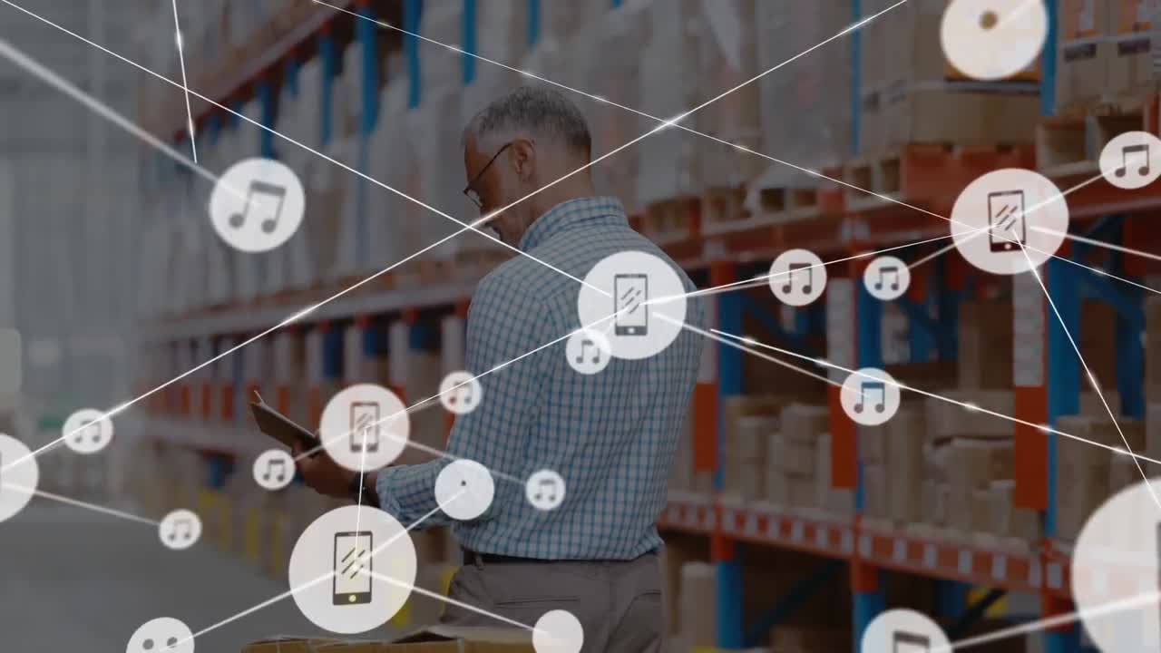 Animation of network of connections with icons over man working in warehouse