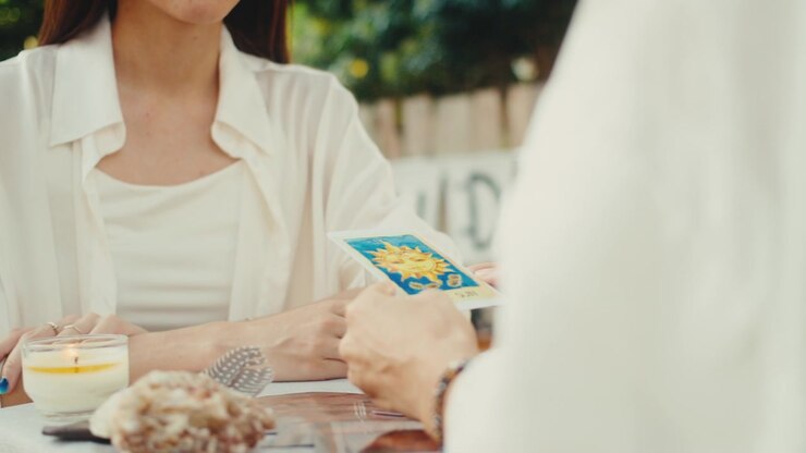 Woman Receiving a Tarot Card Reading Outdoors