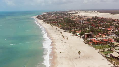 aerial: cumbuco during day with people kitesurfing