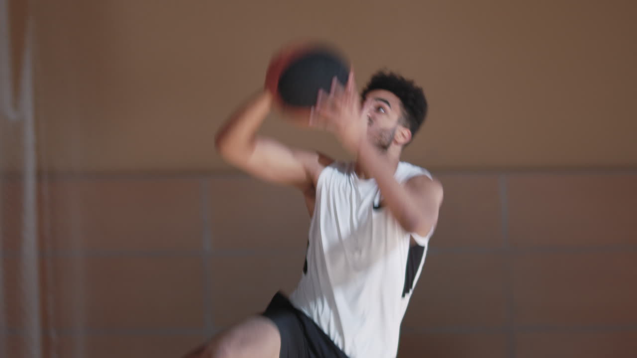 Slowmo of Player Shooting Basketball