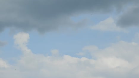 time lapse with white clouds forming on sunny blue sky