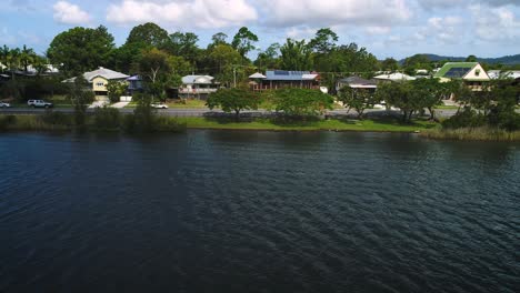 Left-to-right-aerial-view-over-Tumbulgum-along-the-Tweed-River,-Northern-New-South-Wales,-Australia