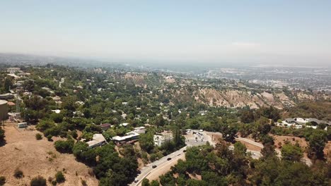 aerial view of mulholland drive in sherman oaks, california in the san fernando valley. slow panning shot during sunset with traffic