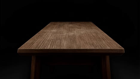 empty wooden table surface on dark background