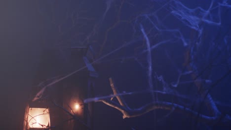 video of halloween lantern, candle and smoke with copy space on purple background
