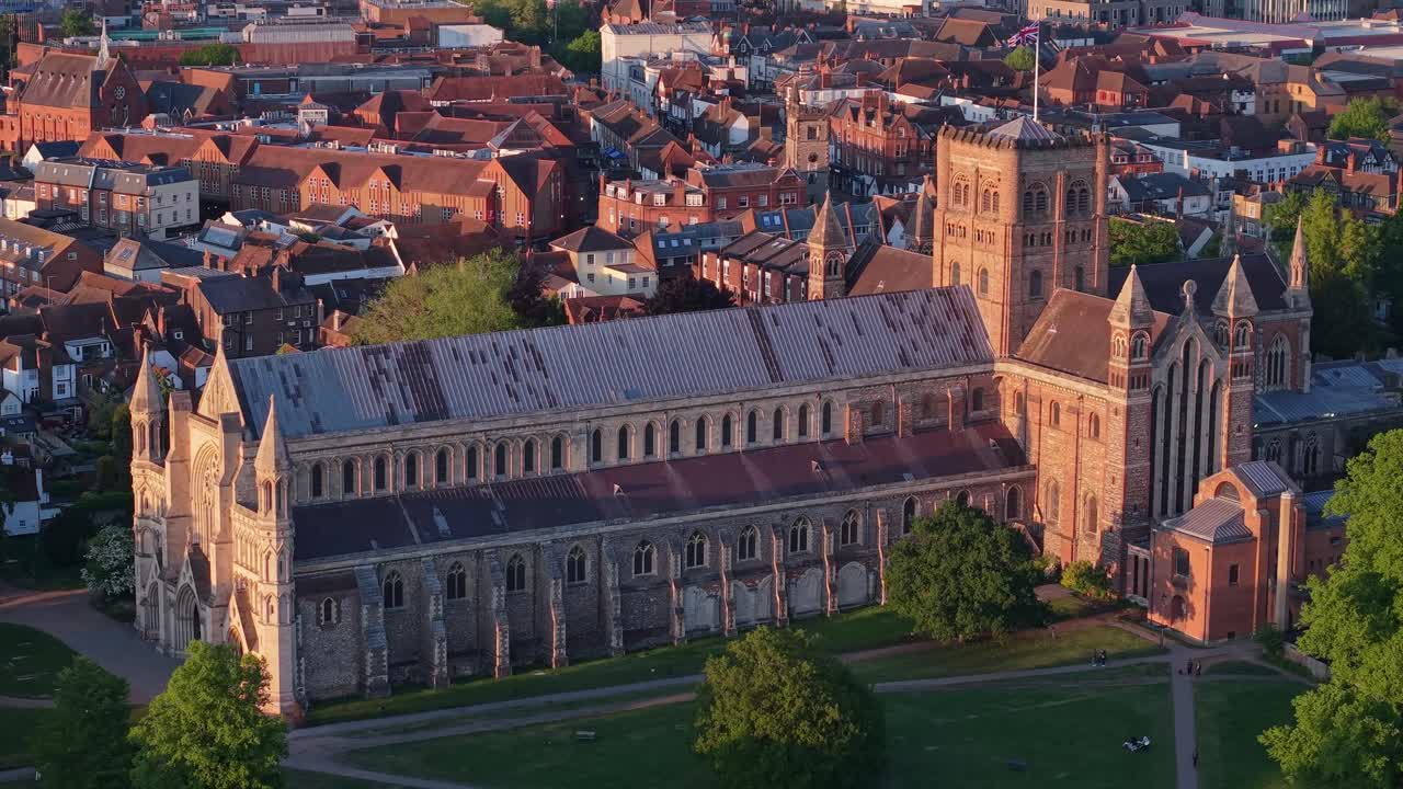 Detailed close-up orbit drone view showcasing the magnificent architecture of St Albans Cathedral from every angle