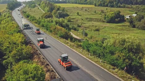 aerial view on the road rollers working on the new road construction site. road construction works.