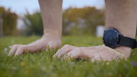 Close-up-shot-of-an-athletic-man-setting-his