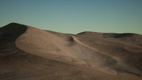 aerial view on big sand dunes in sahara desert at sunrise