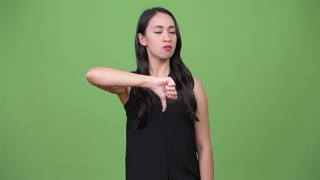 young beautiful asian businesswoman giving thumbs down