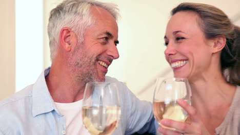 happy couple drinking white wine together