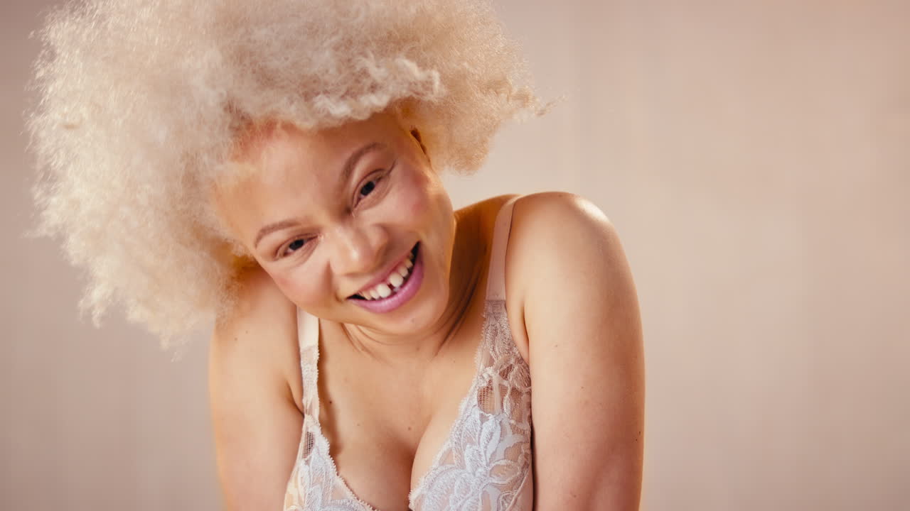 Studio Portrait Shot Of Confident Natural Albino Woman In Underwear Promoting Body Positivity