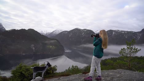 female landscape photographer photographs veafjorden fjord in norway