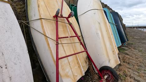 boats lined up along a scenic harbour