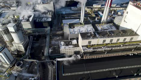 high tilting footage of the smoking and polluting heat and power plant in warsaw, poland