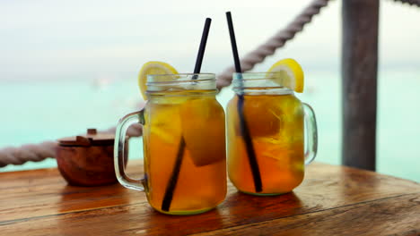 glass of iced tea with lemon on the table