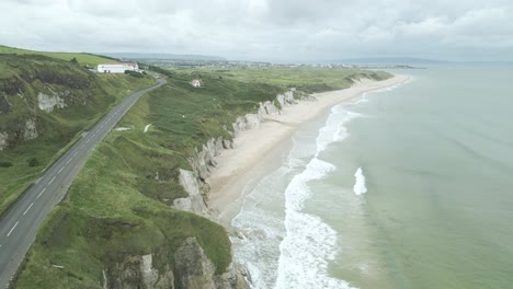 causeway coastal route on limestone cliffs of northern ireland near portrush