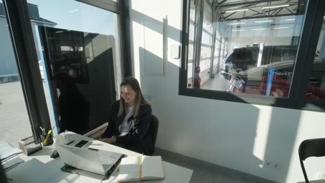 car service manager working at desk in office