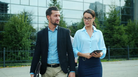 business colleagues walking and discussing