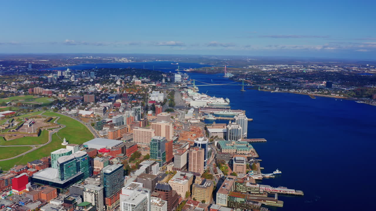 Aerial drone shot over Halifax downtown, Nova Scotia, Canada.
High view of the cityscape, ocean and the urban buildings.