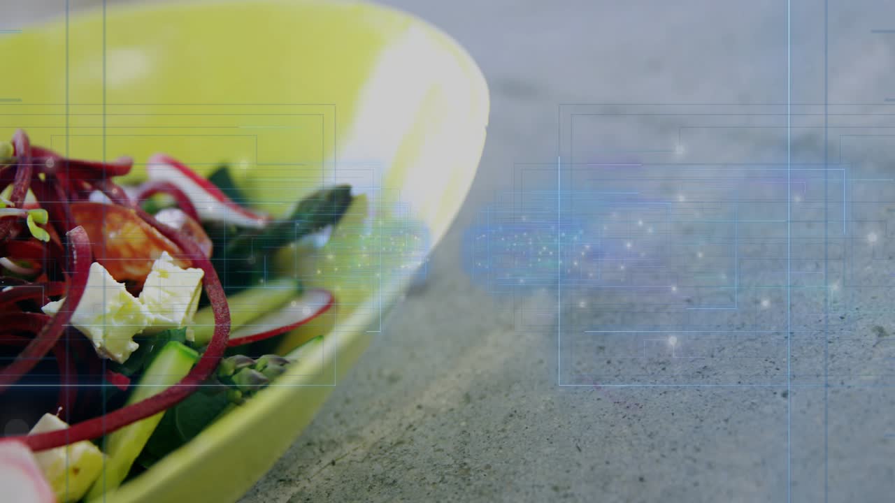 Camera racking focus, shifting, revealing yellow-green bowl, showing salad, overlay emerging right
