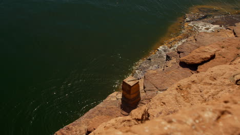 Rocky-Shoreline-Adjacent-to-Abu-Simbel-Temple-Complex,-High-Angle-view