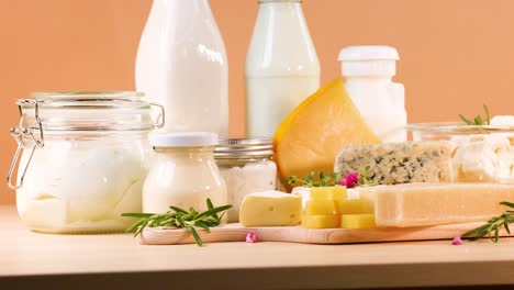 assorted dairy products on an orange background