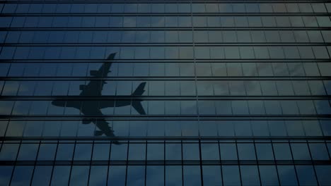 avión reflejado en las ventanas de los rascacielos