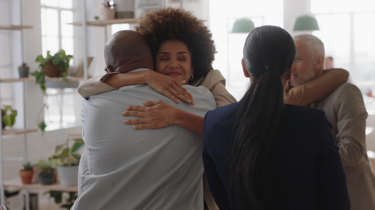 happy business people celebrating successful corporate victory colleagues hugging in office meeting enjoying winning teamwork success