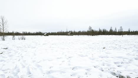 an abandoned yakut village in the middle of a snowy field